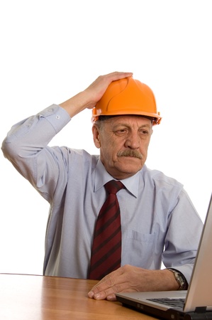 Engineer at the computer isolated on white backgroundの写真素材