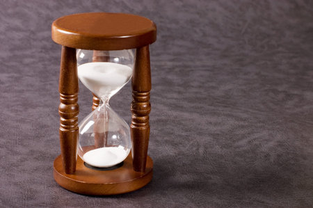 Hourglasses on a grey background