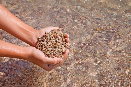 Sea sand in handsの写真素材
