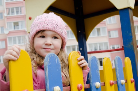 The girl on a children's playgroundの写真素材