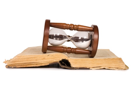 Hourglasses and book isolated on whiteの写真素材