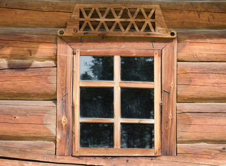 Window in the old wooden house close-upの写真素材