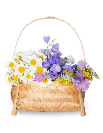 Beautiful flowers in basket isolated on whiteの写真素材