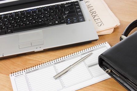 Black portfolio and the computer on tableの写真素材