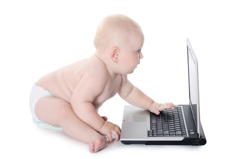 The little baby with the laptop isolatedの写真素材