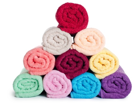 The combined  color towels isolated on whiteの写真素材