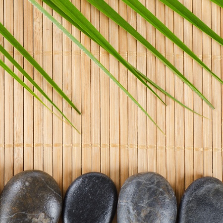 The spa a stone on bamboo backgroundの写真素材