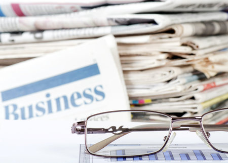 Business newspaper with chart