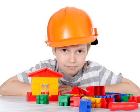 Boy collects the designer  isolated on whiteの写真素材