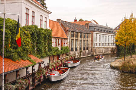 View of canal and houses at Bruges, Belgiumのeditorial素材