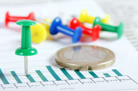 The graphs, charts with multi-coloured push buttonsの写真素材