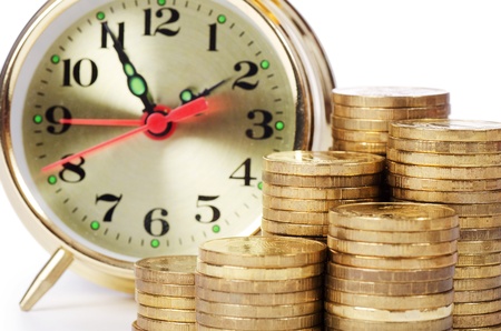 Alarm clock and money isolated on whiteの写真素材