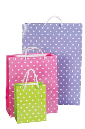 Bright gift bags isolated on white backgroundの写真素材
