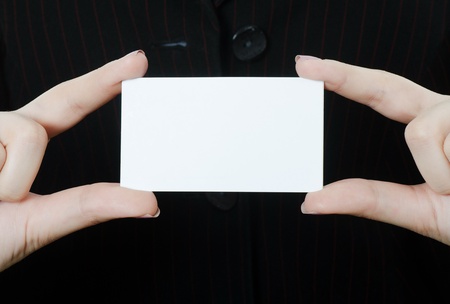 The business woman with the card close-upの写真素材