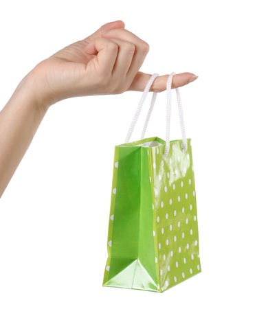 Gift bags in hand isolated on whiteの写真素材