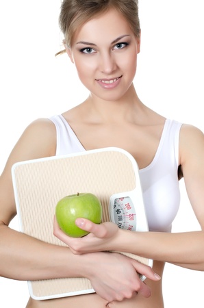 The beautiful girl with apple in handの写真素材