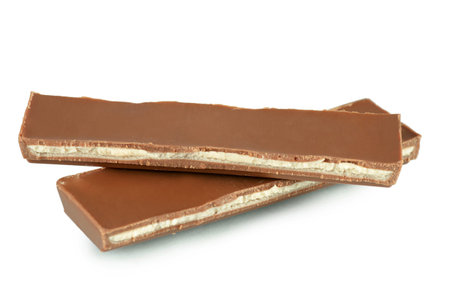 The pile of milk chocolate blocks isolated