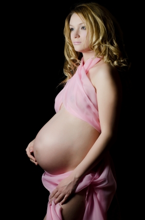 The pregnant woman on a black backgroundの写真素材