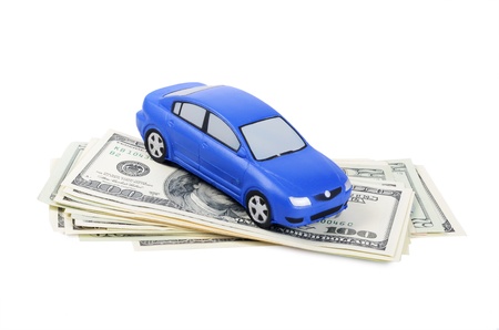 Toy car for dollar banknotes  as backgroundの写真素材