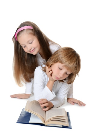 Two girls read book isolated on whiteの写真素材