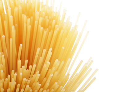Uncooked pasta spaghetti macaroni isolated on whiteの写真素材