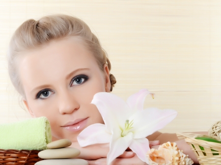 Spa beautiful Woman on a bamboo rugの写真素材