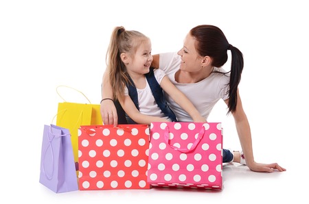 Mom and daughter with a lot packages with shoppingの写真素材
