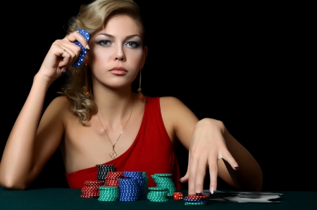 Beautiful woman with casino chips a blackの写真素材