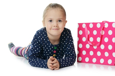 The little girl with two packages isolatedの写真素材