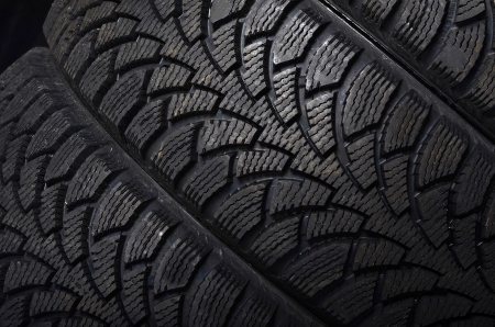 The automobile tire on a black backgroundの写真素材