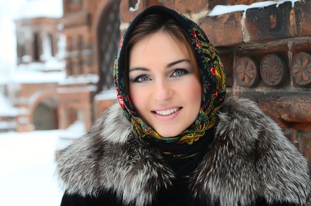 The beautiful woman brunette in the winterの写真素材