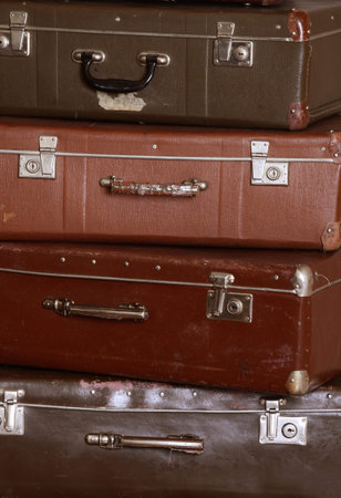 The old retro suitcases at a wallの写真素材