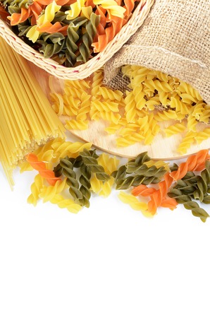 Uncooked pasta spaghetti macaroni isolated on whiteの写真素材