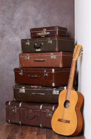 The old retro suitcases at a wallの写真素材