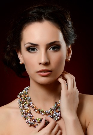 The beautiful woman in expensive pendant close-upの写真素材
