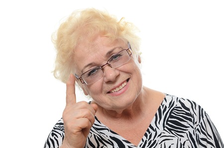 Portrait of old woman isolated on whiteの写真素材