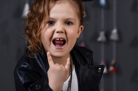 Portrait of a beautiful young female child model wearing a black