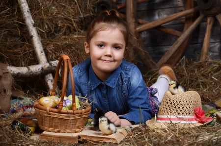 Studio portrait of cute little girl in country styleの写真素材