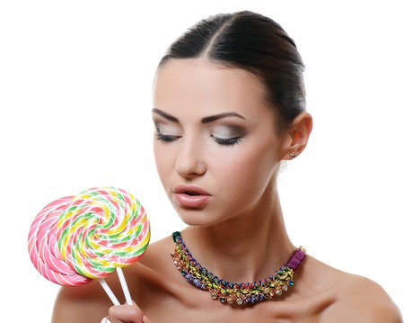 The girl with a sugar candy isolatedの写真素材