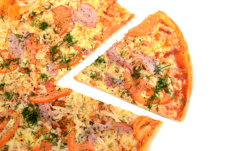 Pizza with a slice removed. Isolated on whiteの写真素材