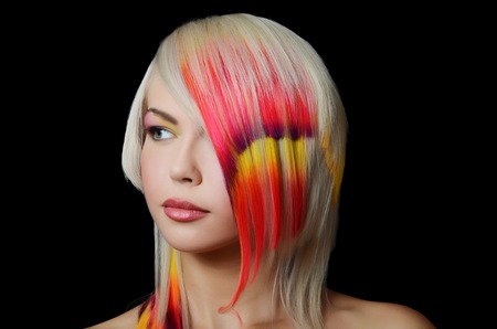 Woman with bright make-up and multi-coloured strand in hairの写真素材