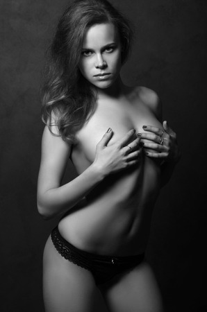 fashion monochrome portrait of beautiful young nude womanの写真素材