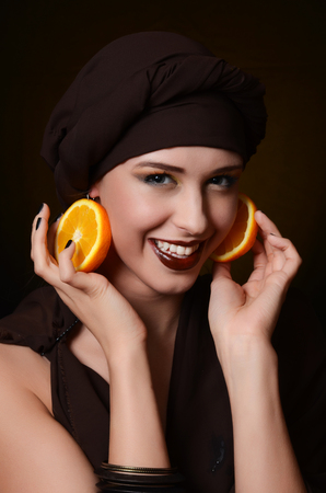 The beautiful woman in a turban with a creative make-upの写真素材
