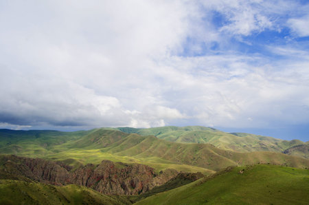 Beautiful landscape with green mountains and magnificent cloudy sky in Armenia