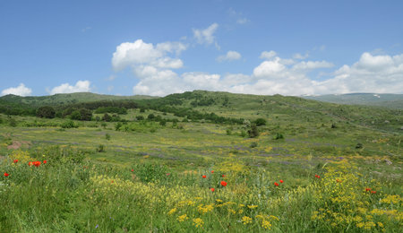 Beautiful landscape with green mountains and magnificent cloudy sky in Armenia