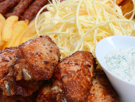 Fried chicken with fries on a plateの写真素材