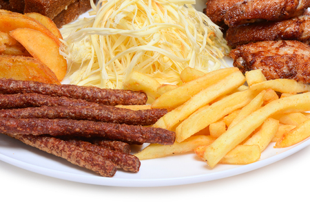 Fried chicken with fries on a plateの写真素材