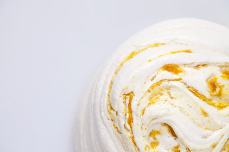 Lemon meringue on white background. Close-up. Top view.