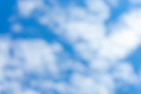 White clouds in a bright blue sky.