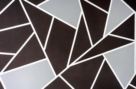 Abstract background of brown and gray geometric shapes.